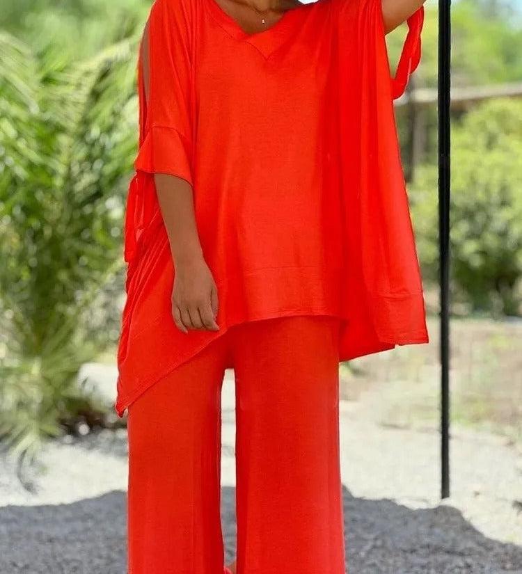Orange V-neck tunic with draped sleeves and wide-leg pants set