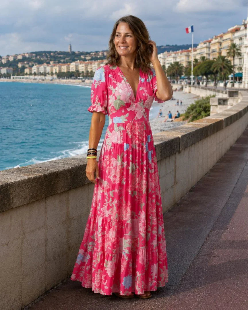 Pink floral maxi dress with V-neck, flutter sleeves, gathered tiered skirt