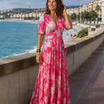 Pink floral maxi dress with V-neck, flutter sleeves, gathered tiered skirt