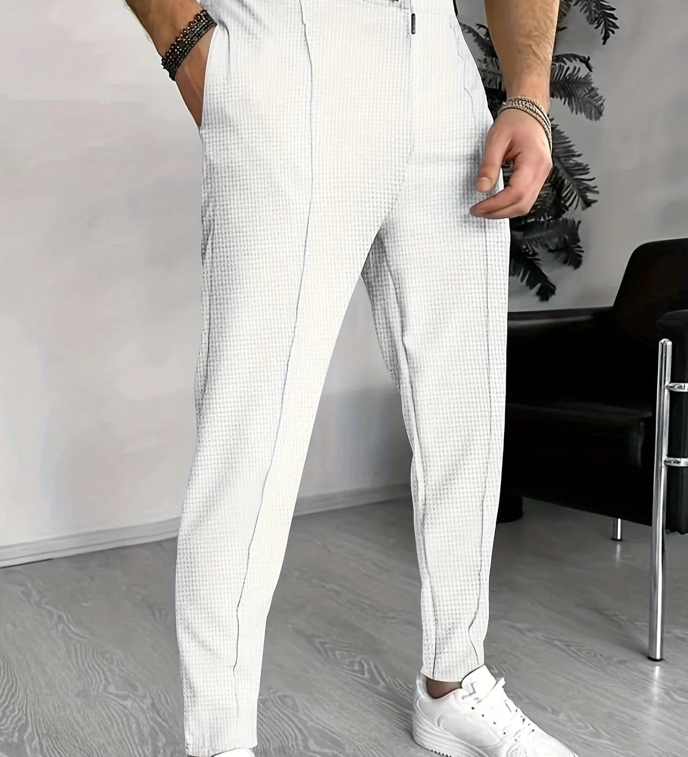 White checkered jogger pants with drawstring waist and tapered fit