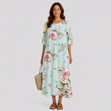 Floral midi dress with 3/4 sleeves, gathered waist, and light blue base color