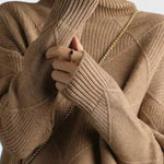 Brown turtleneck sweater with ribbed collar and diamond knit texture