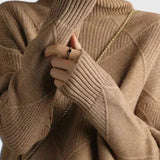 Brown turtleneck sweater with ribbed collar and diamond knit texture