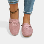 Pink suede lace-up loafers with stitched trim and rounded moc toe.