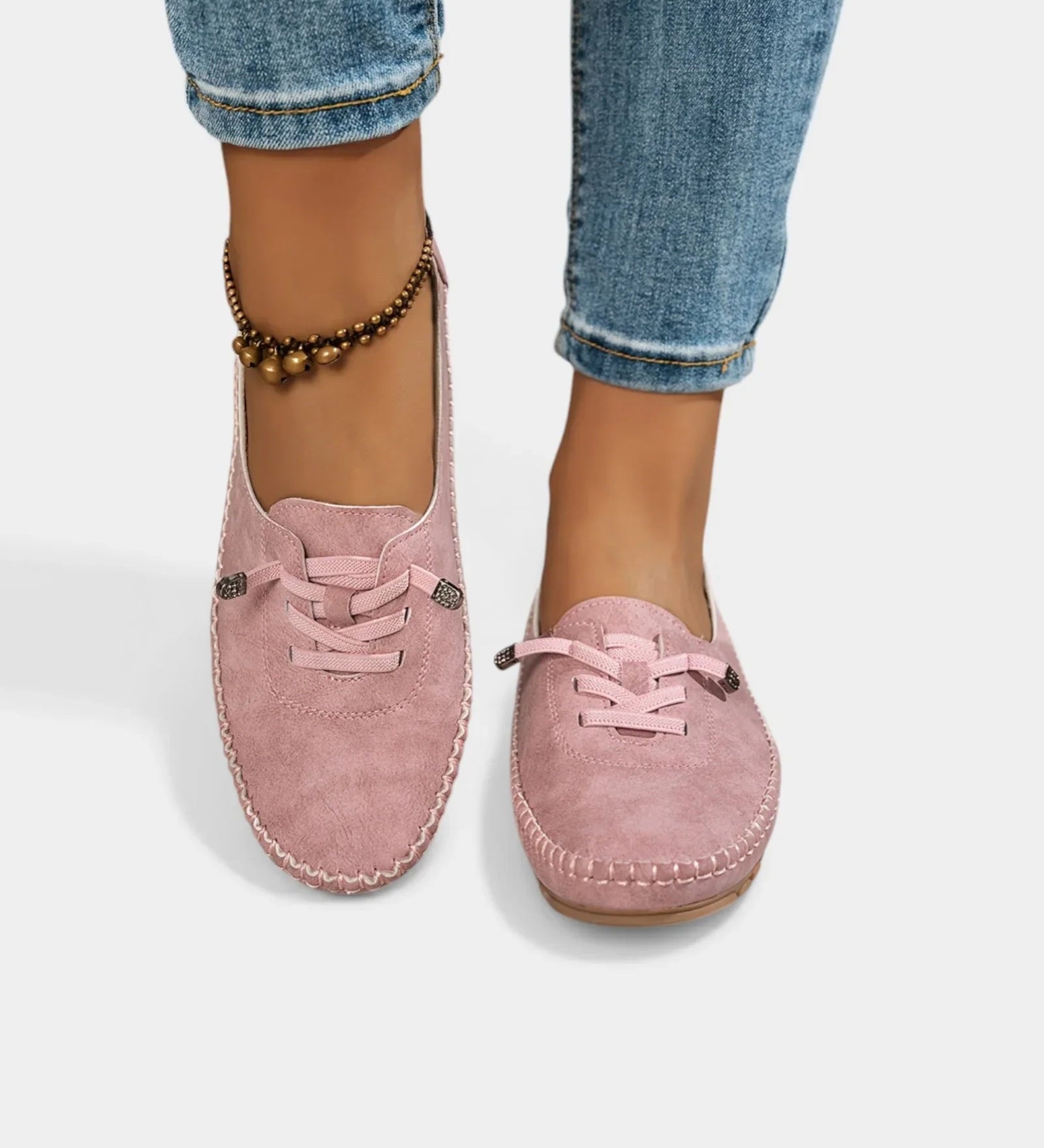 Pink suede lace-up loafers with stitched trim and rounded moc toe.