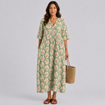 Floral summer midi dress in light green with V-neck, gathered waist, and 3/4 sleeves