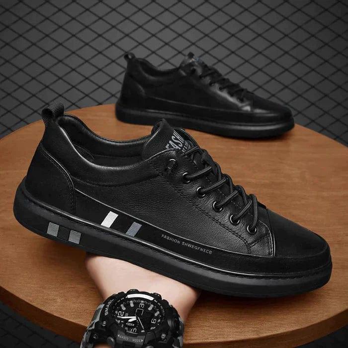Black lace-up orthopedic shoes on display, with side stripe and chunky sole