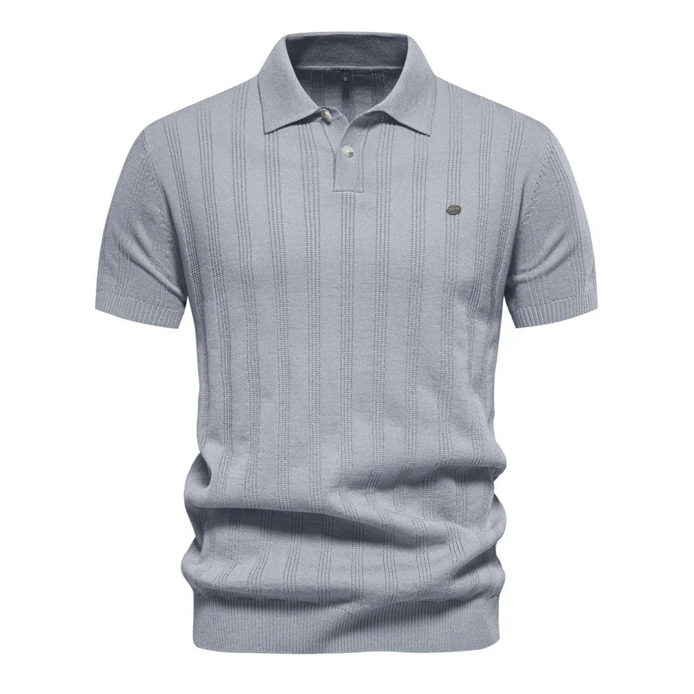 Chic summer polo shirt in light blue-gray with vertical pinstripes, short sleeves, button placket.