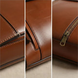 Caramel leather backpack close-up of stitching, flap edge, and brass zipper pull