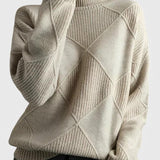 Ivory turtleneck sweater with ribbed knit and diamond pattern on the front