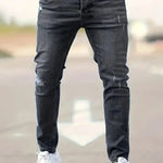 Slim-fit ripped jeans in black wash, distressed knees and fitted straight legs