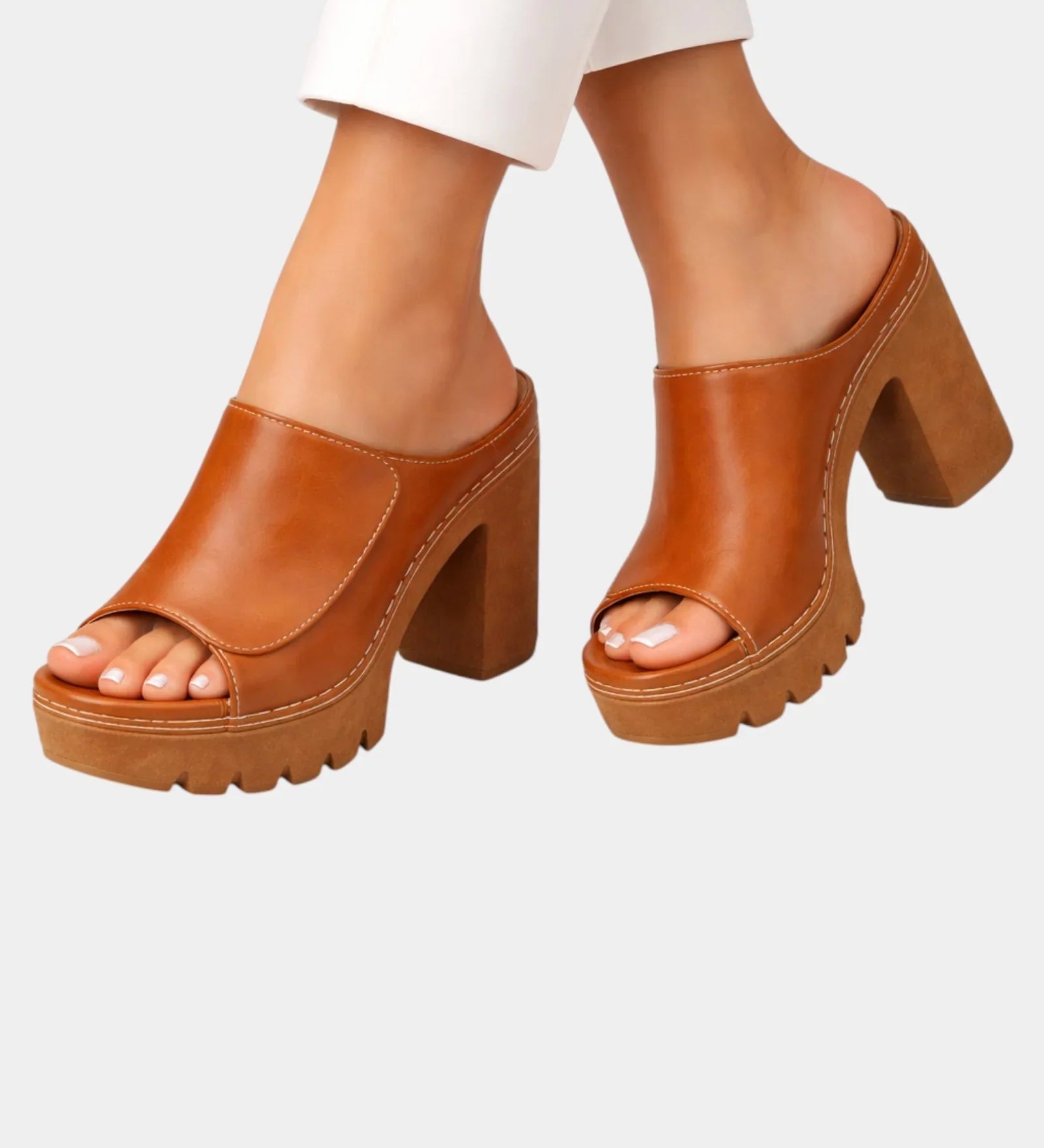 Brown platform heeled mules with open toe and chunky lug sole, slip-on style