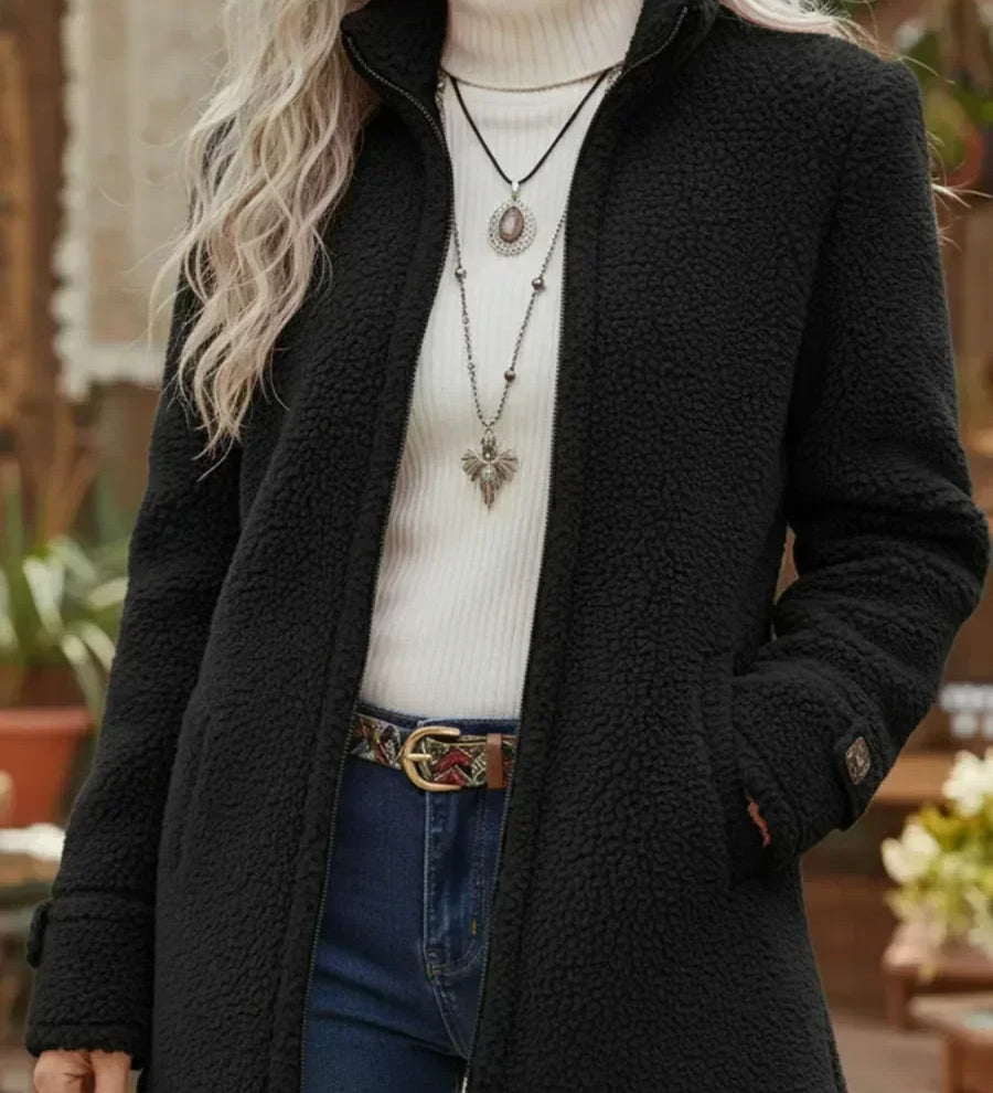 Black soft mid-length textured coat with front zipper and stand collar