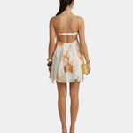 Women's floral mini dress, open back with thin cross straps and ruffled hem