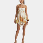 Women's floral mini dress with thin straps and gathered ruffle skirt