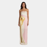 Strapless maxi dress with abstract face print in pink, yellow, and cream