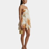Women's floral mini dress, side view, thin straps and tiered ruffle hem
