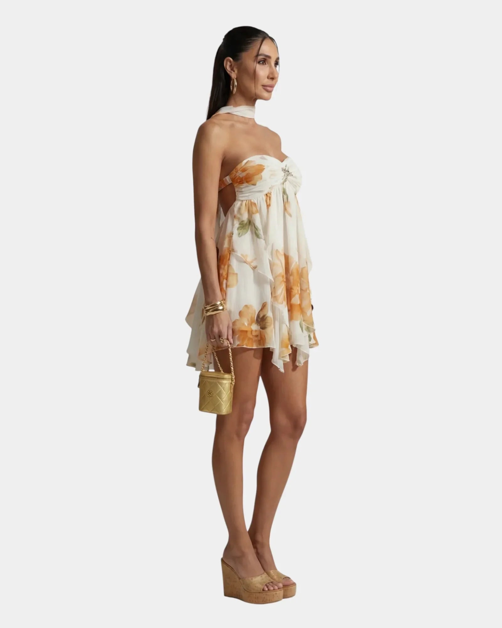 Women's floral mini dress, side view, thin straps and tiered ruffle hem