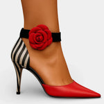 Wine red pointed-toe heels with black ankle strap, striped side panel, and red rose detail.