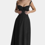 Black midi dress with spaghetti straps and fitted skirt with subtle bust ruching