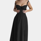 Black midi dress with spaghetti straps and fitted skirt with subtle bust ruching