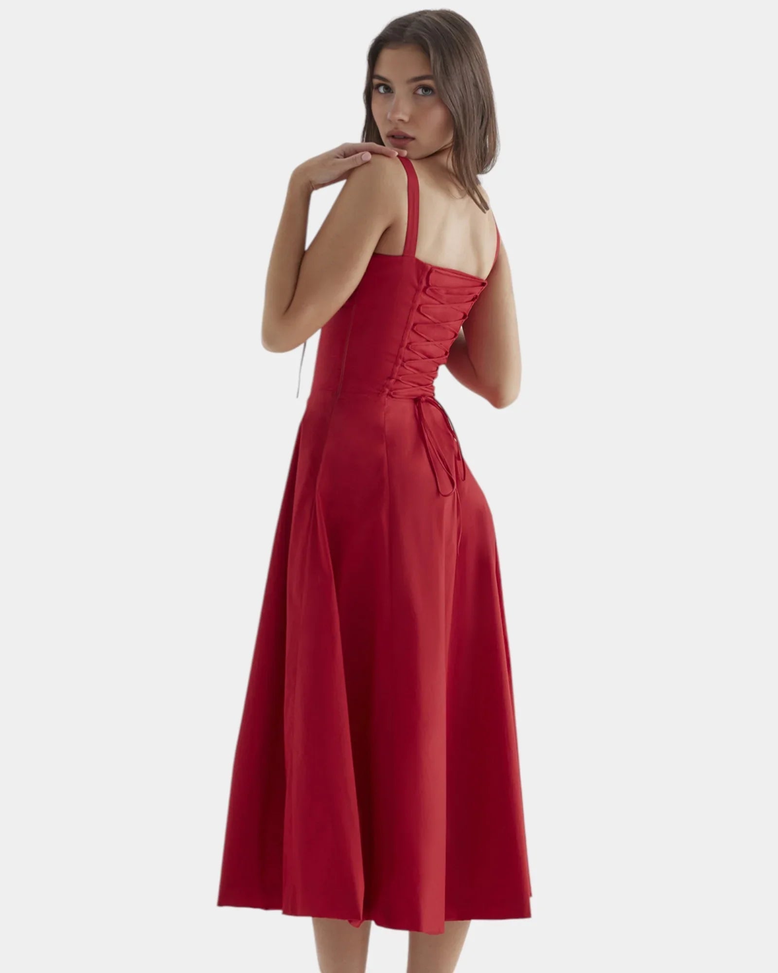Red midi dress with spaghetti straps, ruched bodice, and flared knee-length skirt
