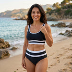 Black striped bikini swimsuit close-up, scoop neck crop top and high-cut bottoms