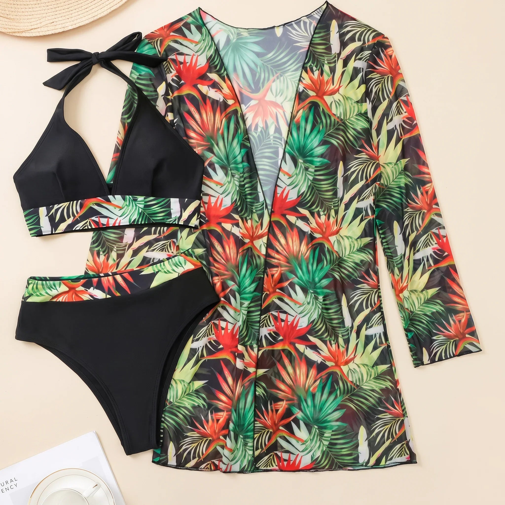 Black-trim tropical swim set with long floral cover-up and halter bikini