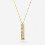 Gold-tone pendant necklace with long rectangle charm and sparkling stones
