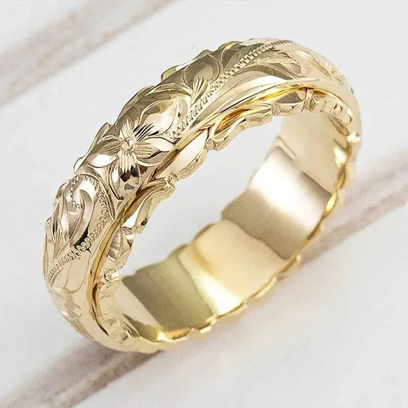 Gold ring with engraved floral band and antiquity-inspired detailing, comfort fit