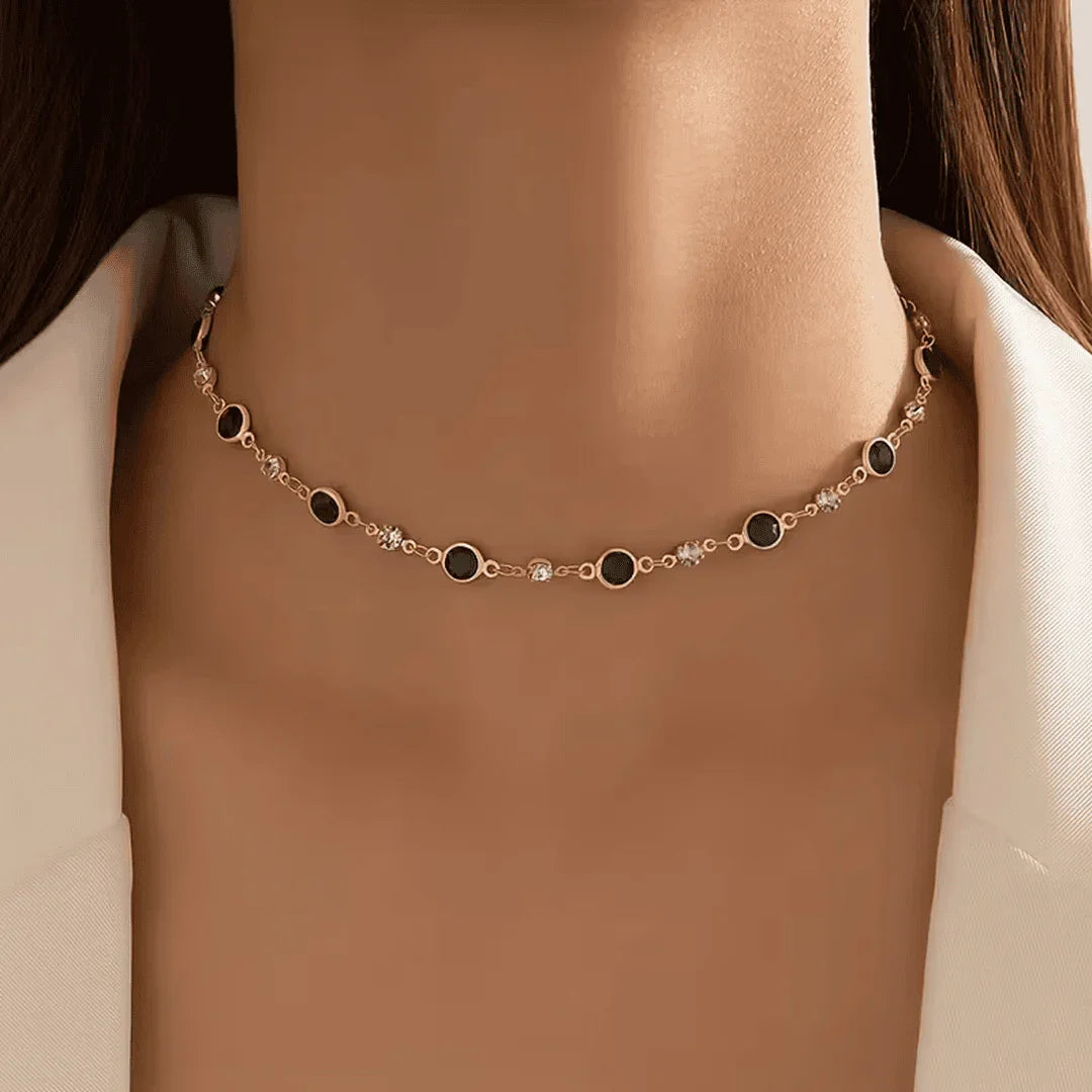 Gold-tone station necklace with dark green oval links