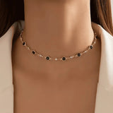Gold-tone station necklace with dark green oval links