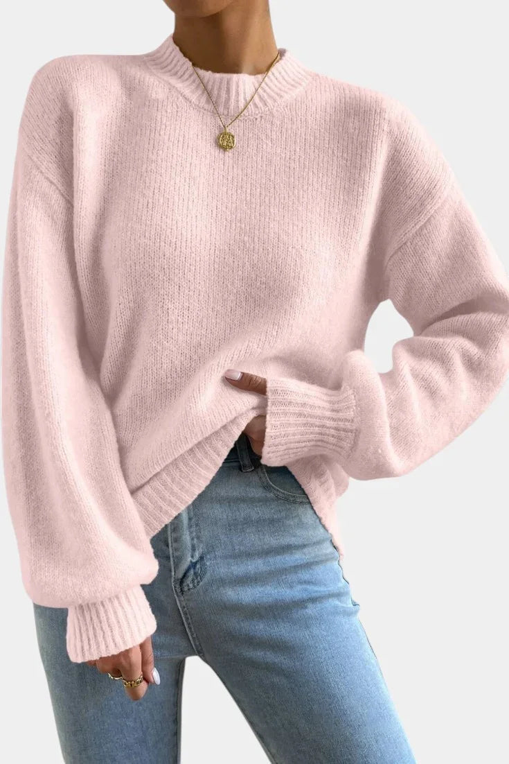 Pink round-neck sweater with puff sleeves and ribbed cuffs