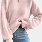 Pink round-neck sweater with puff sleeves and ribbed cuffs