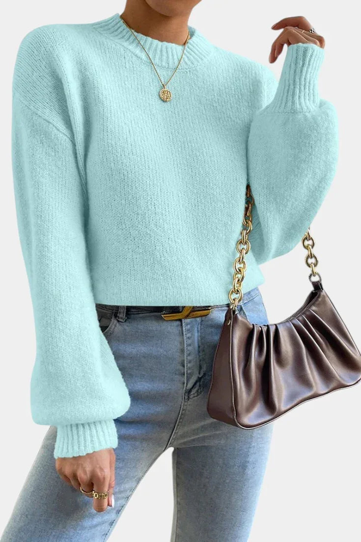 Light blue round-neck sweater with puff sleeves and ribbed cuffs