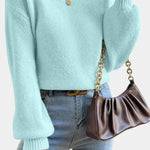 Light blue round-neck sweater with puff sleeves and ribbed cuffs
