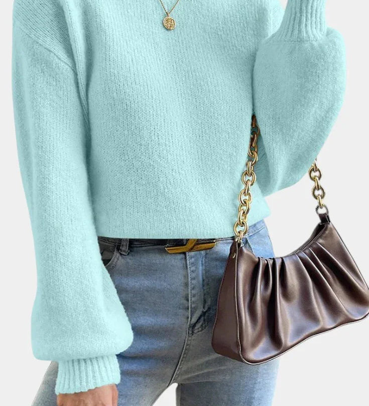 Light blue round-neck sweater with puff sleeves and ribbed cuffs