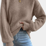 Brown round-neck sweater with puff sleeves and ribbed cuffs