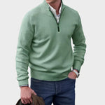 Green half-zip knit sweater with ribbed collar, cuffs, and hem.
