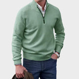 Green half-zip knit sweater with ribbed collar, cuffs, and hem.