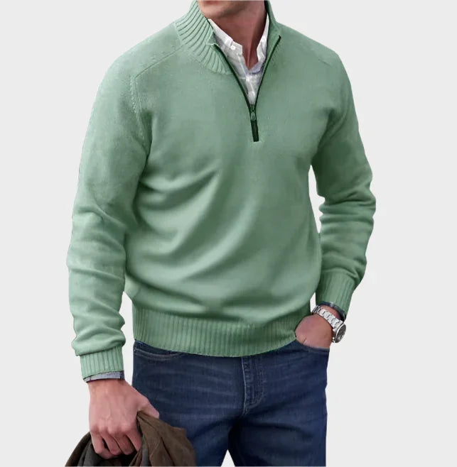 Green half-zip knit sweater with ribbed collar, cuffs, and hem.