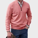 Pink half-zip knit sweater with ribbed collar, cuffs, and hem.