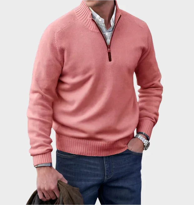 Pink half-zip knit sweater with ribbed collar, cuffs, and hem.