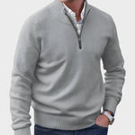 Light gray half-zip knit sweater with ribbed collar, cuffs, and hem.