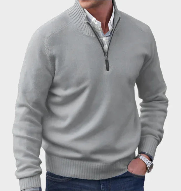 Light gray half-zip knit sweater with ribbed collar, cuffs, and hem.