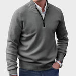 Dark gray half-zip knit sweater with ribbed collar, cuffs, and hem.