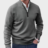 Dark gray half-zip knit sweater with ribbed collar, cuffs, and hem.