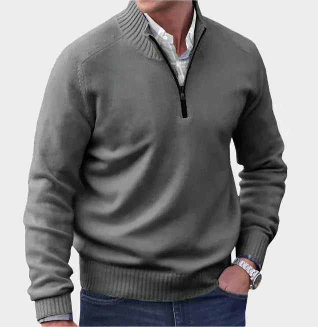 Dark gray half-zip knit sweater with ribbed collar, cuffs, and hem.