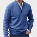 Blue half-zip knit sweater with ribbed collar, cuffs, and hem.