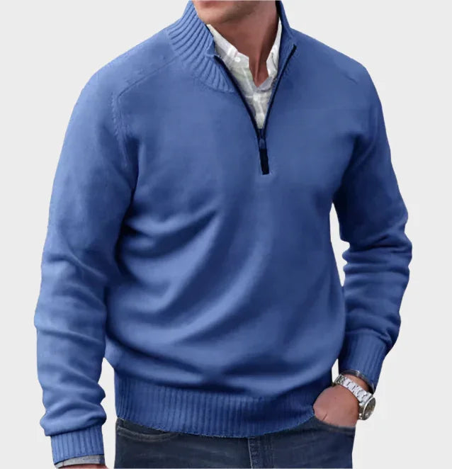 Blue half-zip knit sweater with ribbed collar, cuffs, and hem.